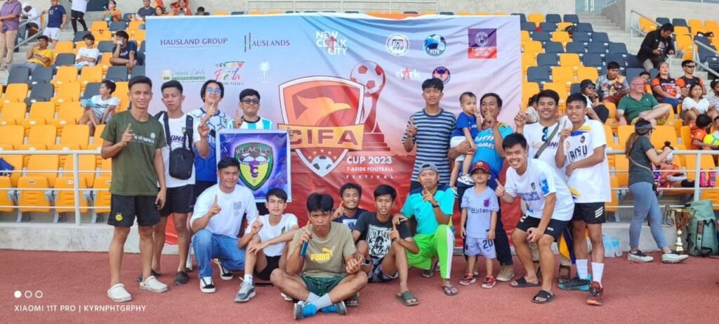 WLAC Football Club players and supporters pose together at the CIFA Cup 2023 football festival in New Clark City.