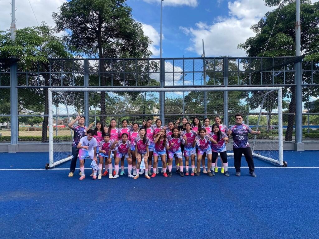 TSL United Football Club players posing after training in Taguig.