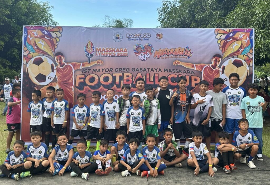 Ajuy Paglaum Football Club youth players proudly posing at the 1st Mayor Greg Gasataya MassKara Football Cup 2025 in Bacolod City.