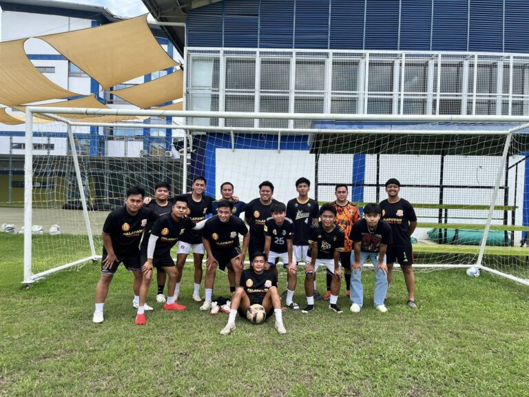 Palapa 1ne Football Club players posing together after training on a football field in Pampanga, Philippines