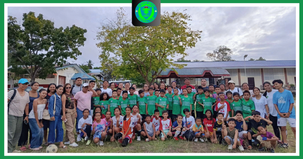 Group photo of youth players, parents, and supporters from a Philippine Football Club wearing green jerseys in Negros Oriental.