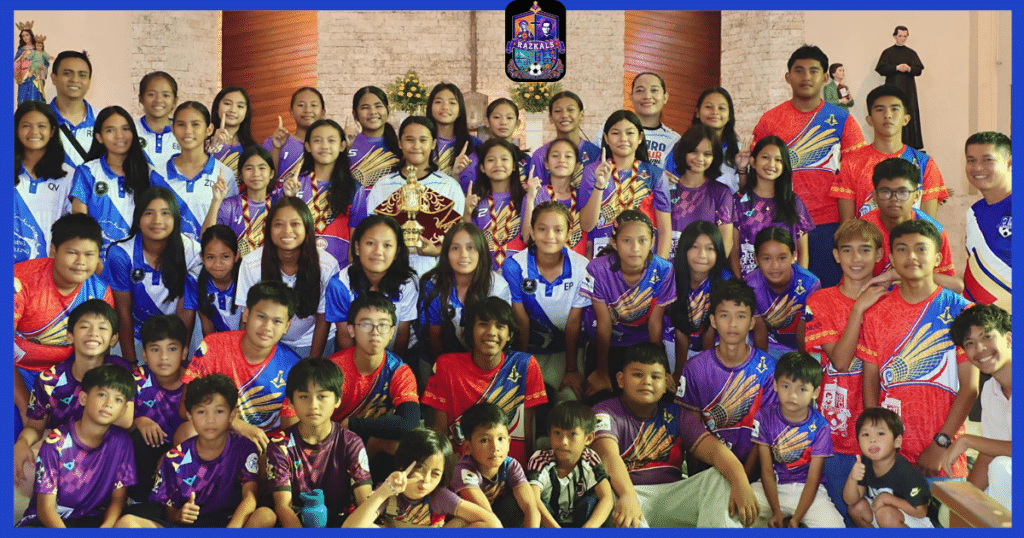 Razkals United FC players and coaches gathered for a group photo with a football trophy in Cebu