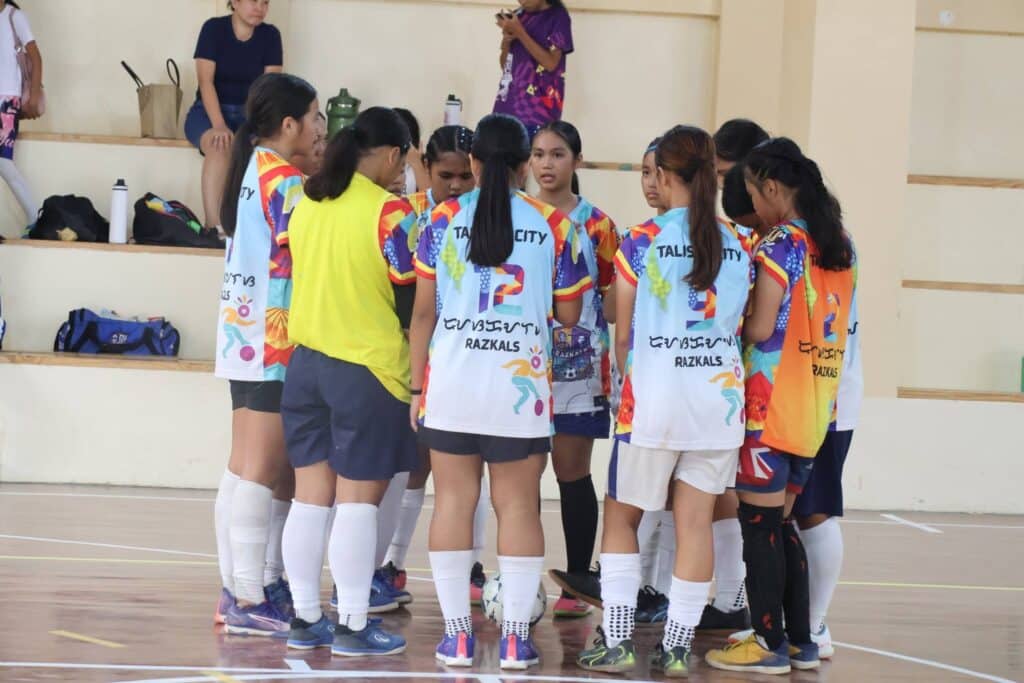 Razkals United FC girls futsal players preparing for a match in Cebu